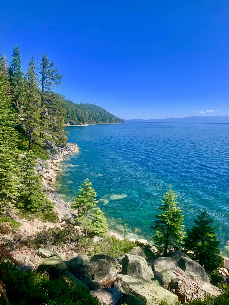 Blue lake with a rocky shoreline