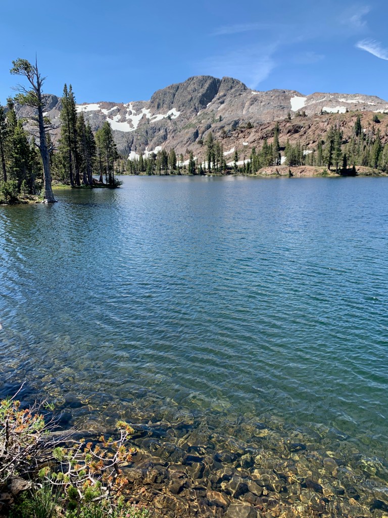 Lake with mountains in the background
