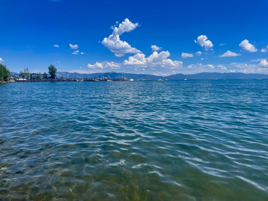 calm lake water with boats